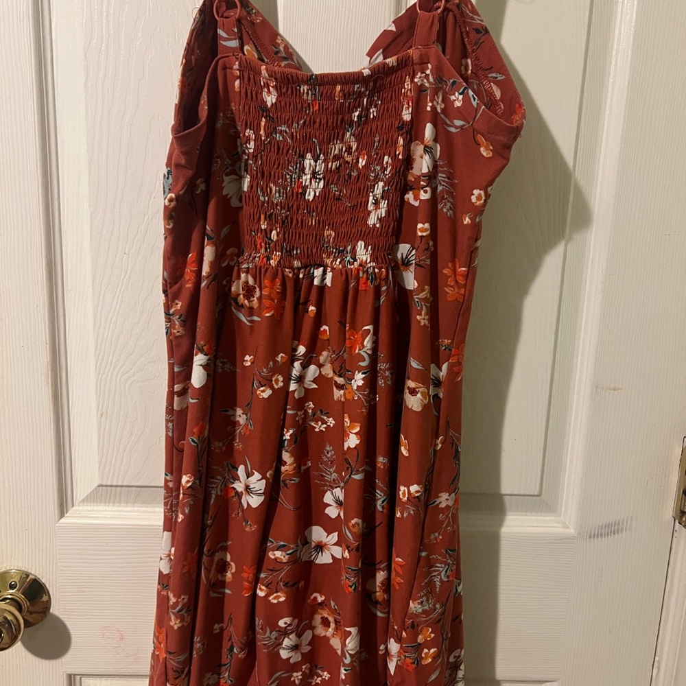 Floral dress that is a soft stretchy material with adjustable straps.